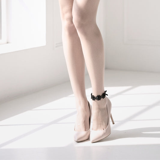 Blossom Black Flower Bow Anklet on model in nude heels