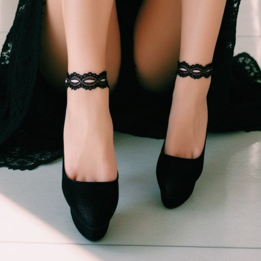 Chantilly Black Lace Pink Ribbon Anklet on Model in Black Dress