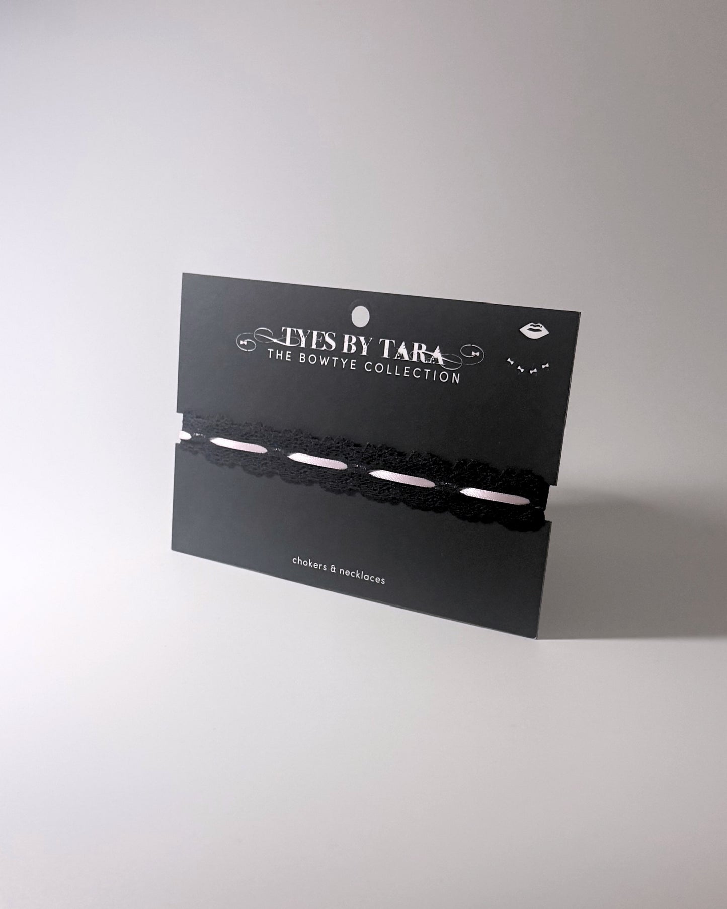 Chantilly Black Lace Bow Choker on black card