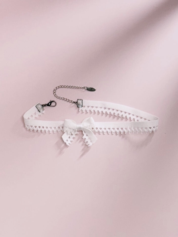Foxy White Bow Choker on Pink Background