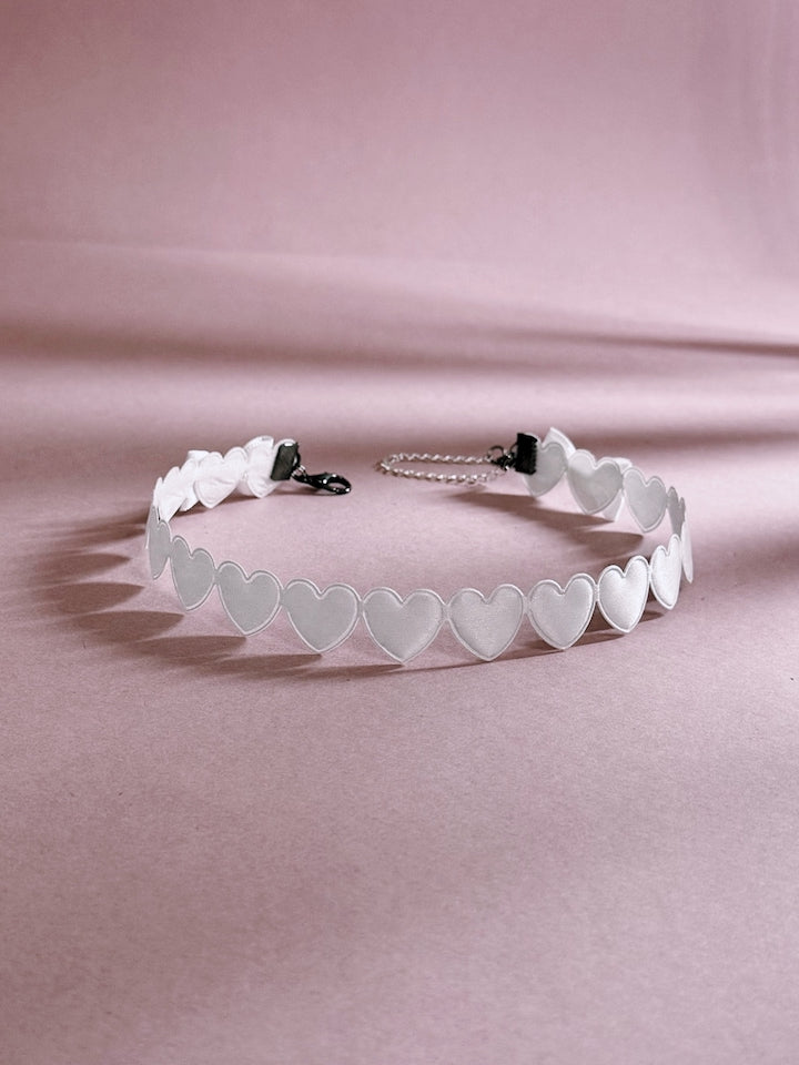 White Heart Choker on Pink Background