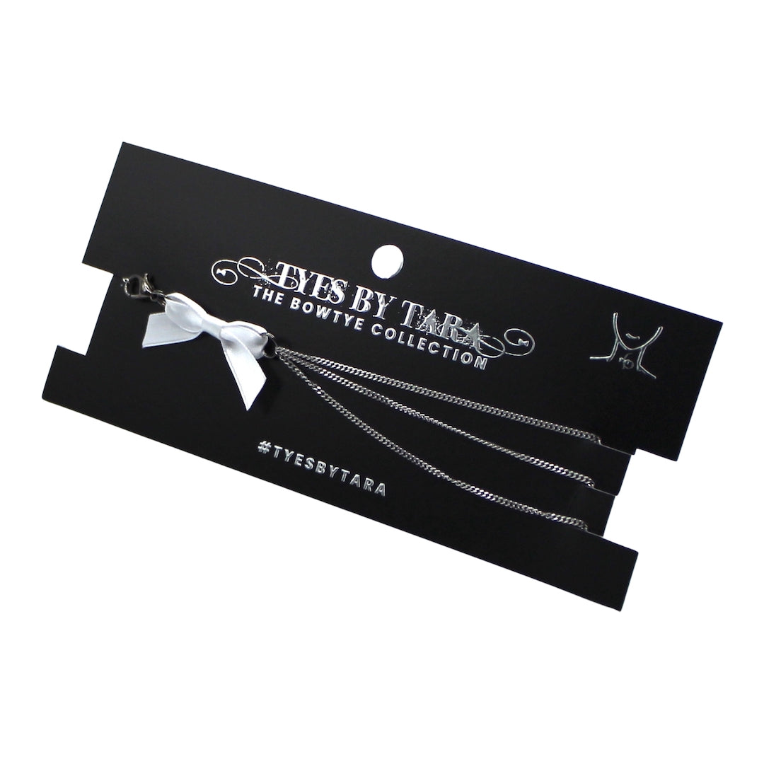 vice white bow silver chain necklace on black card