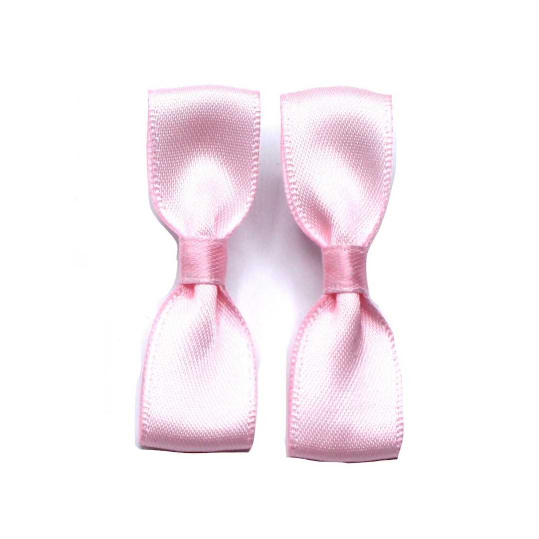 Pink Bow Earrings on White Background