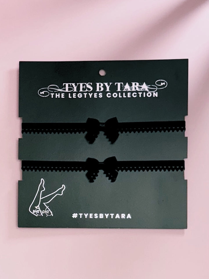 Foxy Black Bow Leg Garters on Black Card
