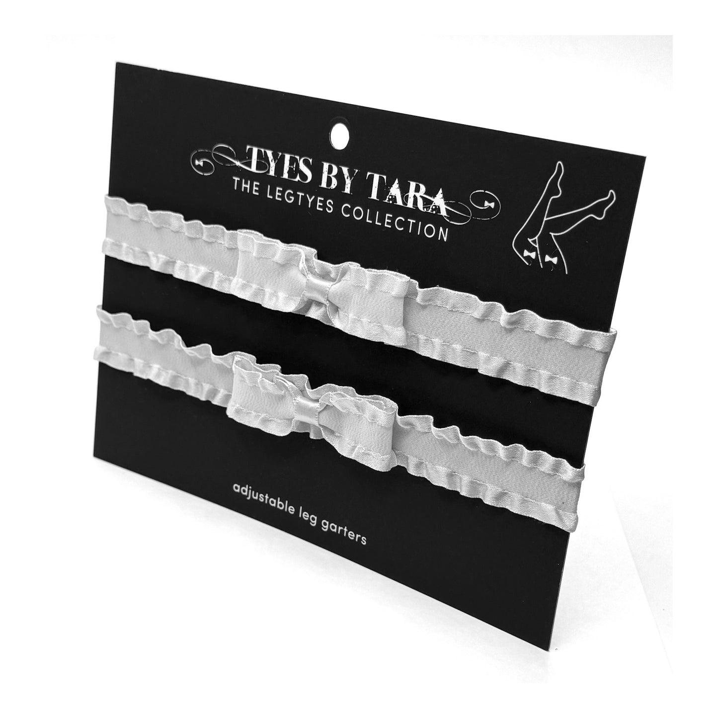 Pair of adjustable leg garters on a 'Tyes by Tara' branded card.