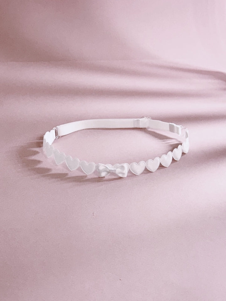 White Heart Leg Garters on Pink Background