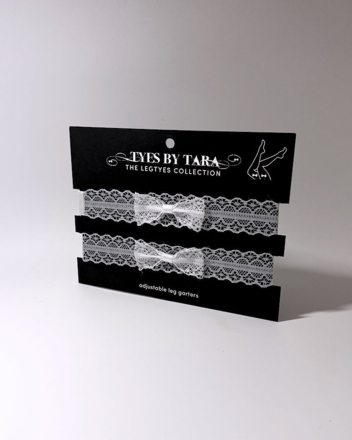 packaging view of siren white lace bow leg garters