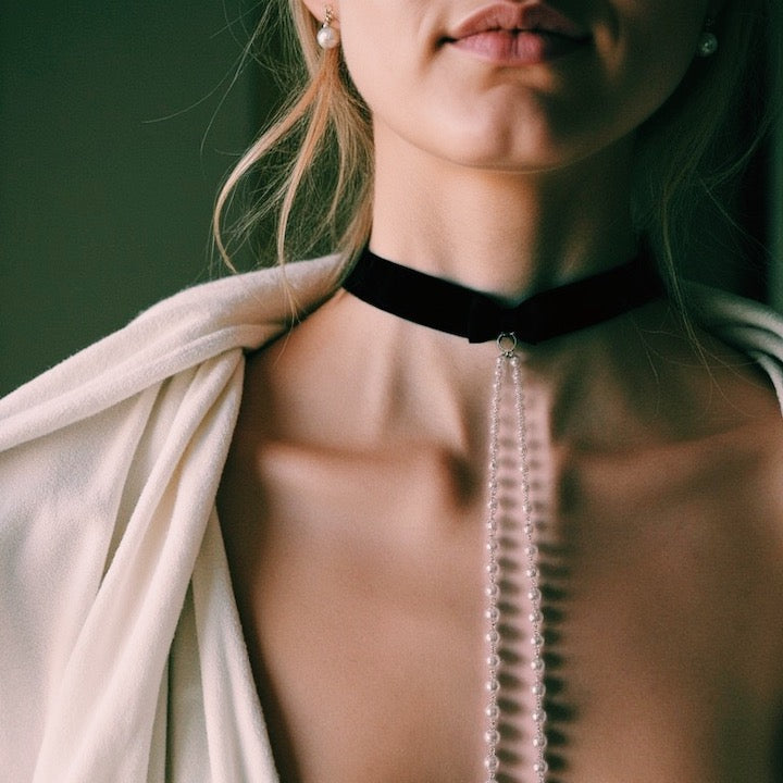 Model in White Blazer in Pearl Nipple Clamp Necklace