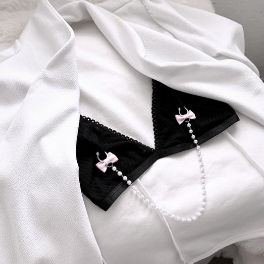 Centerfold Pink Pearl Nipple Clamps on Black Bra in white boudoir