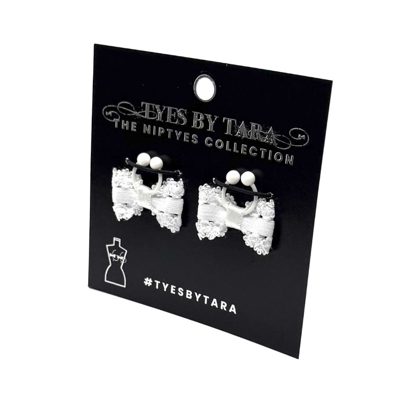 Lady White Bow Nipple Clamps on black card on white background
