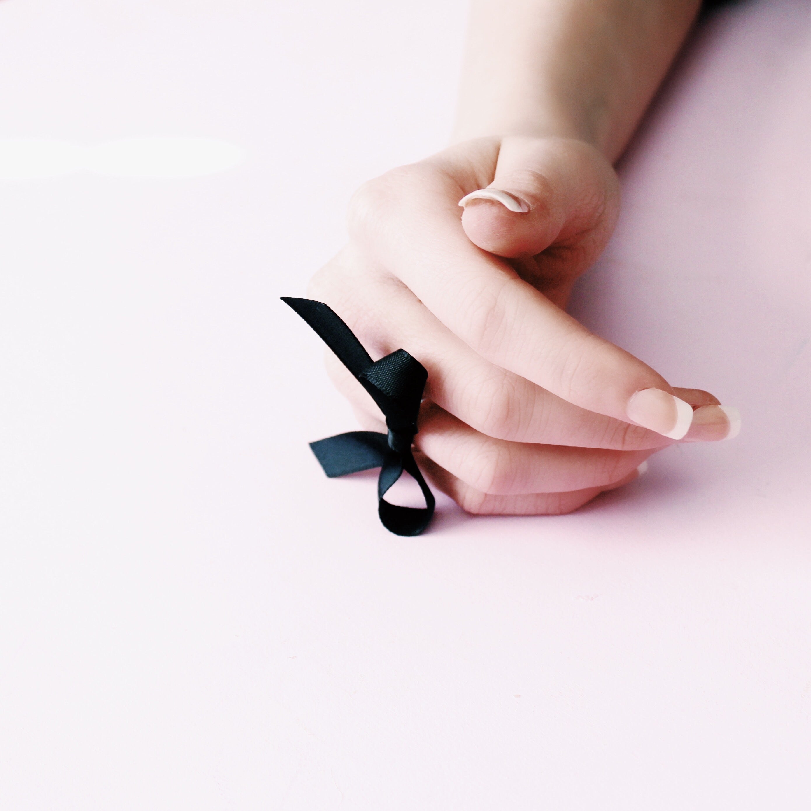 XO Black Bow Ring with Pink Background