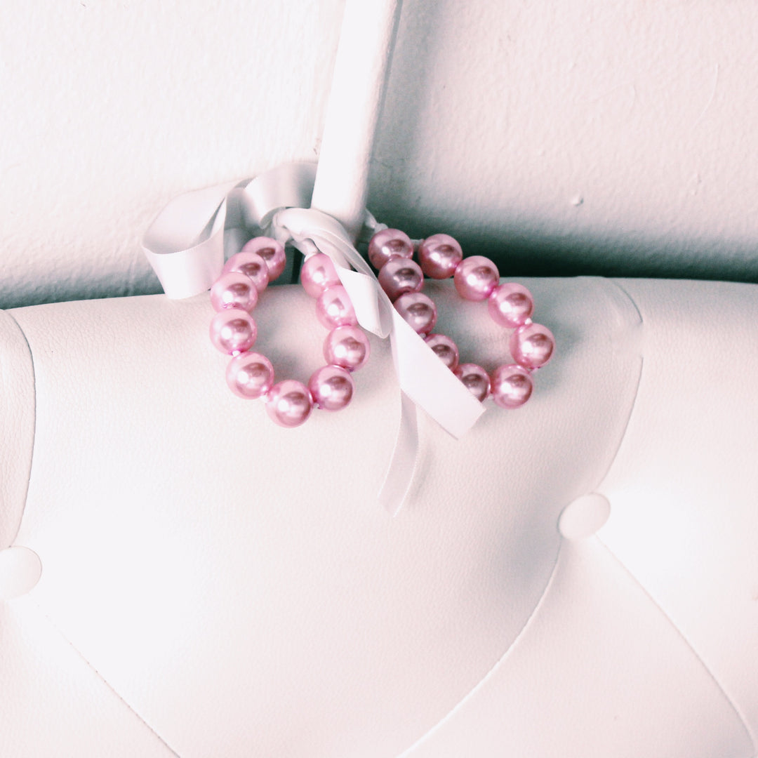 Faux Pink Pearl Handcuffs on Bed Post