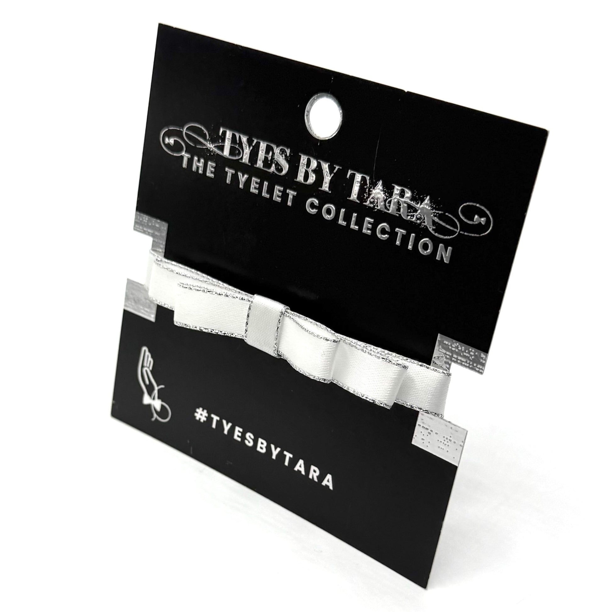 Queen White Bow Metallic Silver Trim Bracelet on Black Card