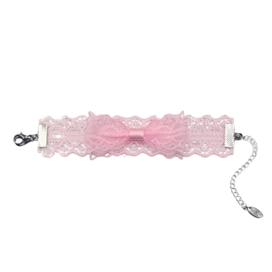 flatlay of siren pink lace bow bracelet