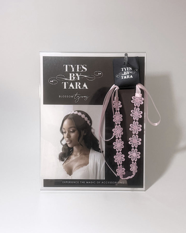 A Counter Display with Model wearing the Blossom Pink Flower Headband