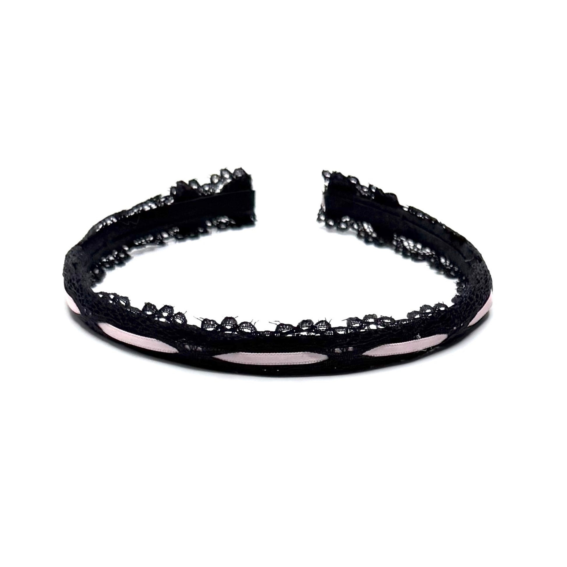 Black lace headband on a white background top view