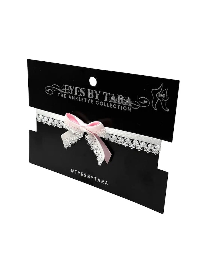 belle-white-lace-elastic-pink-bow-anklet on black card and white background