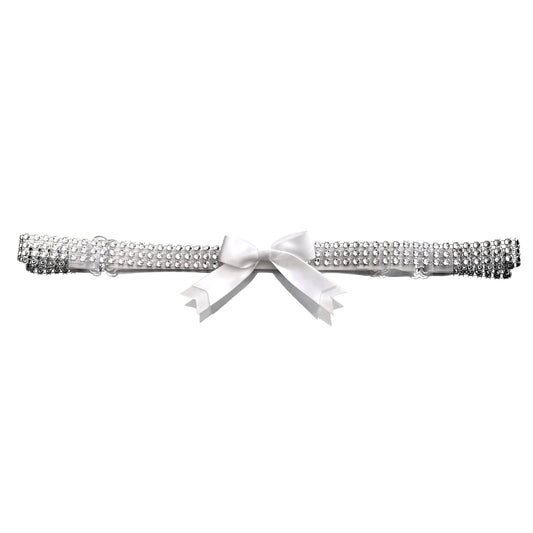 Silver sparkly belt with a white bow on a white background
