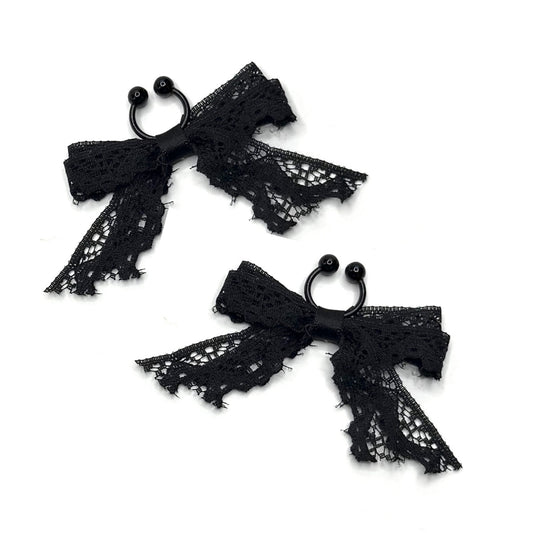 black lace bow nipple clamps on white background