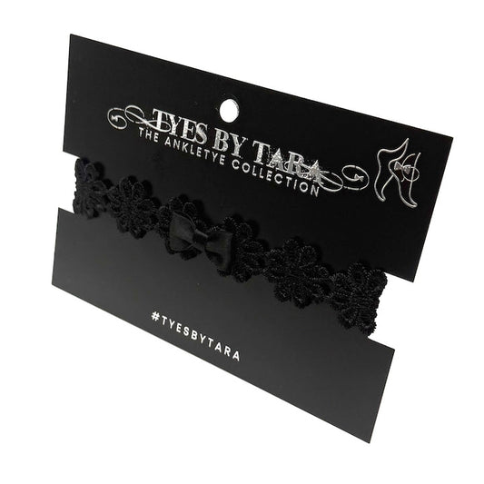 black flower bow anklet on black card