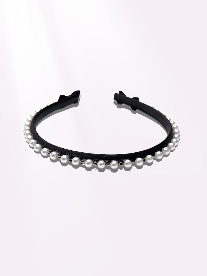 Centerfold Black Pearl Headband on Light Pink Background Top View