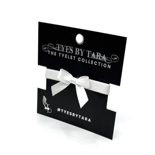 Packaging View of Kinkette White Bow Bracelet