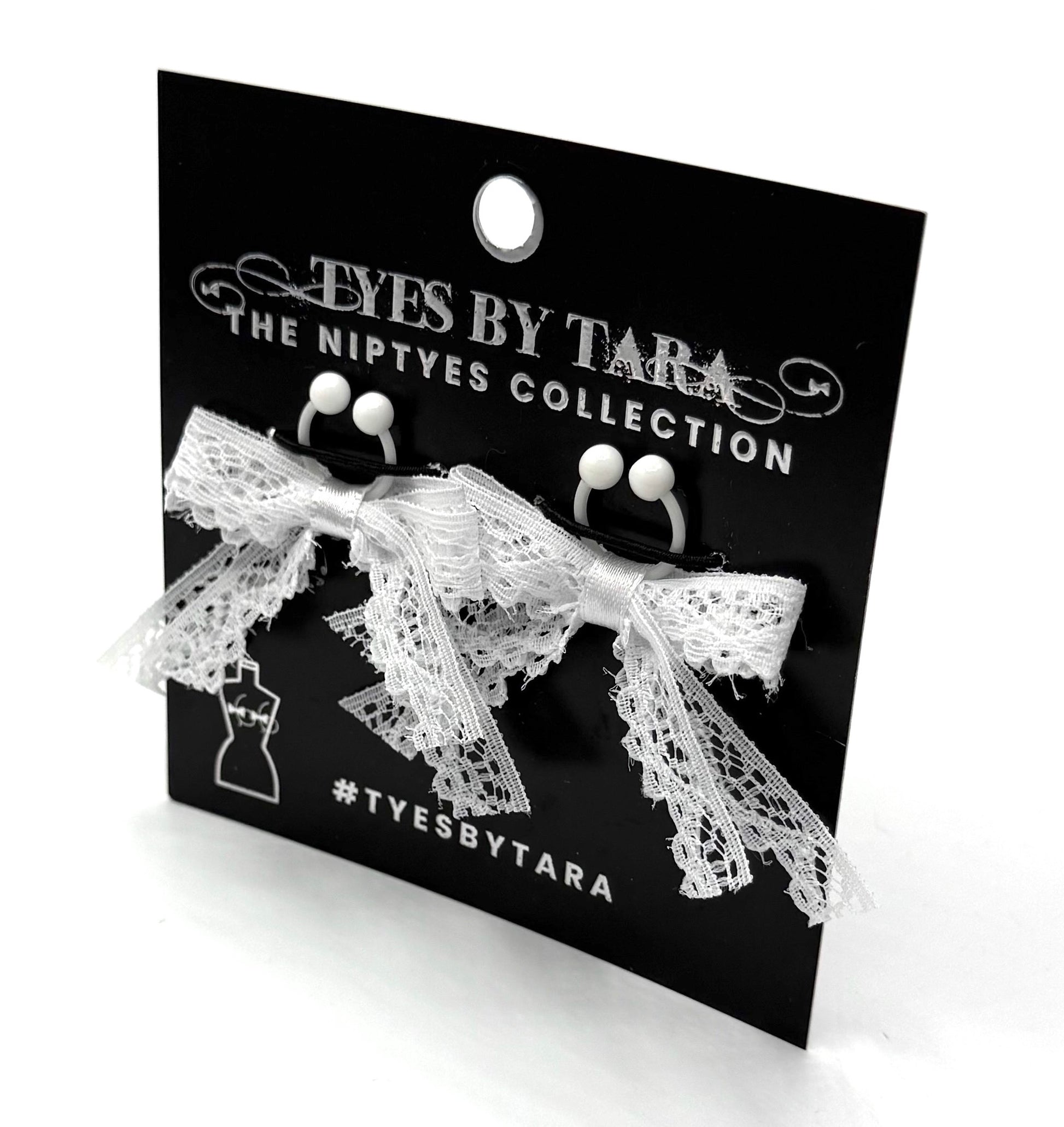 white lace bow nipple clamps on black card