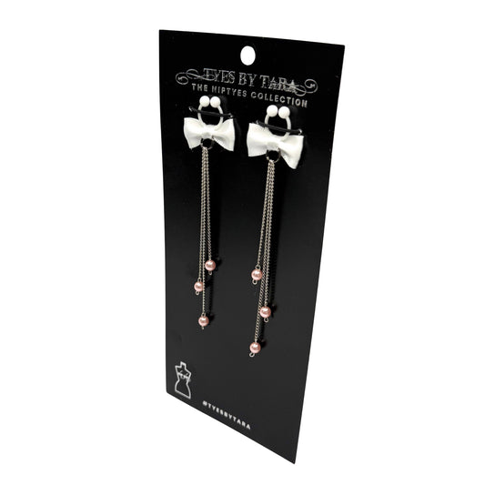 pearl nipple ties on black card