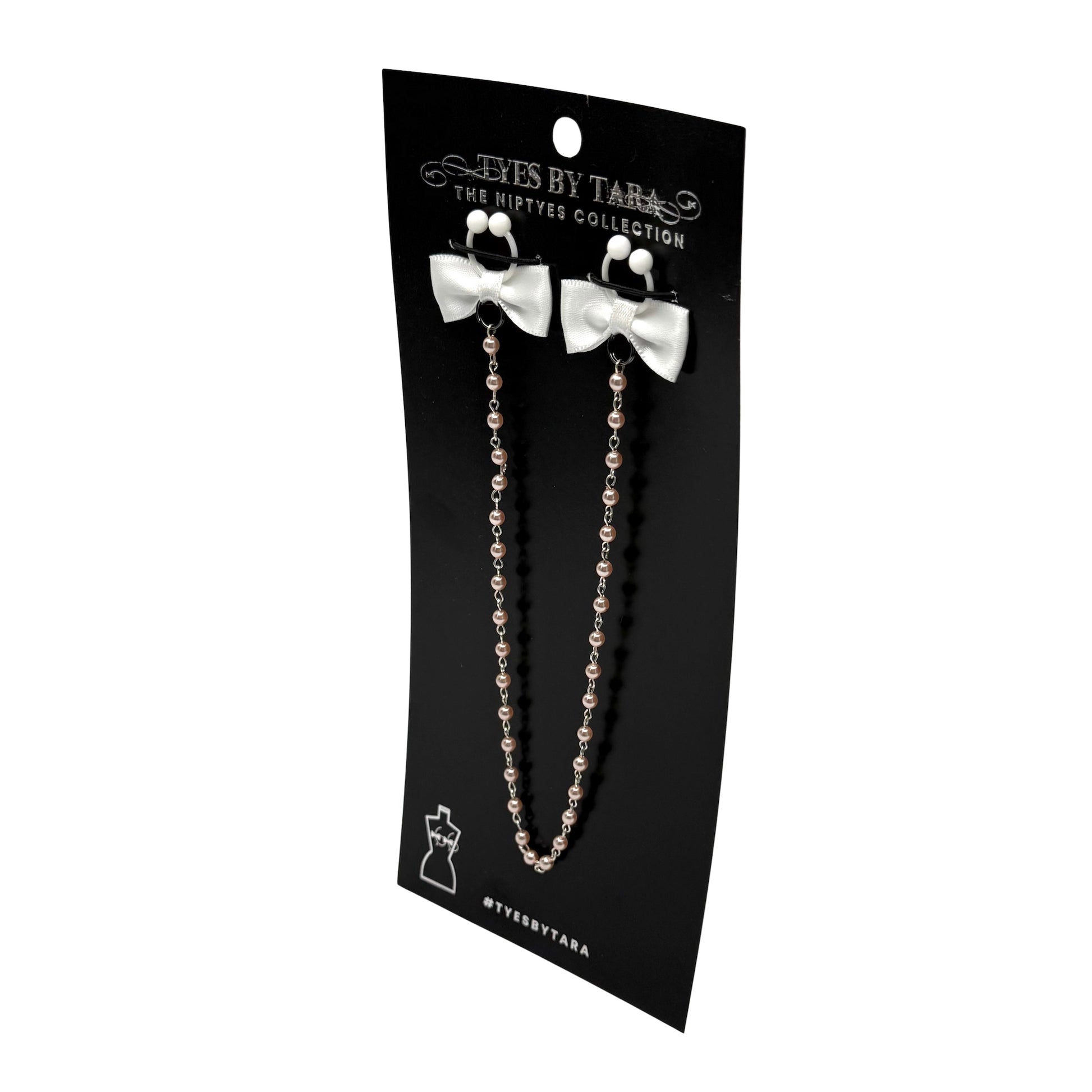 white pearl nipple ties on black card