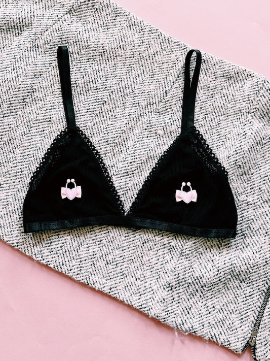 pink heart nipple clamps on black bra