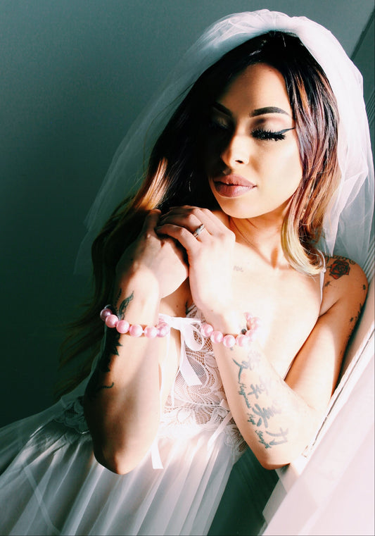 Bride Wearing Pearl Pink Handcuffs