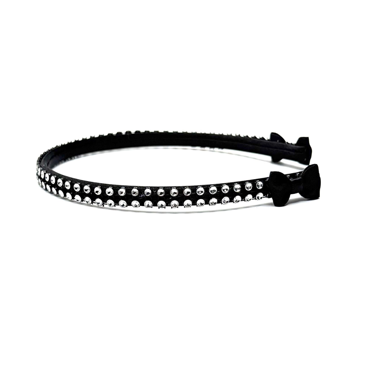 Black hairband with black and silver rhinestone mesh with black bows at the end on white background Side View