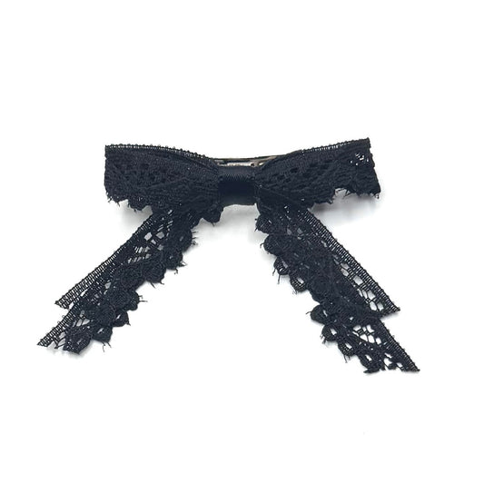 tease black lace hair bow barrette on white background