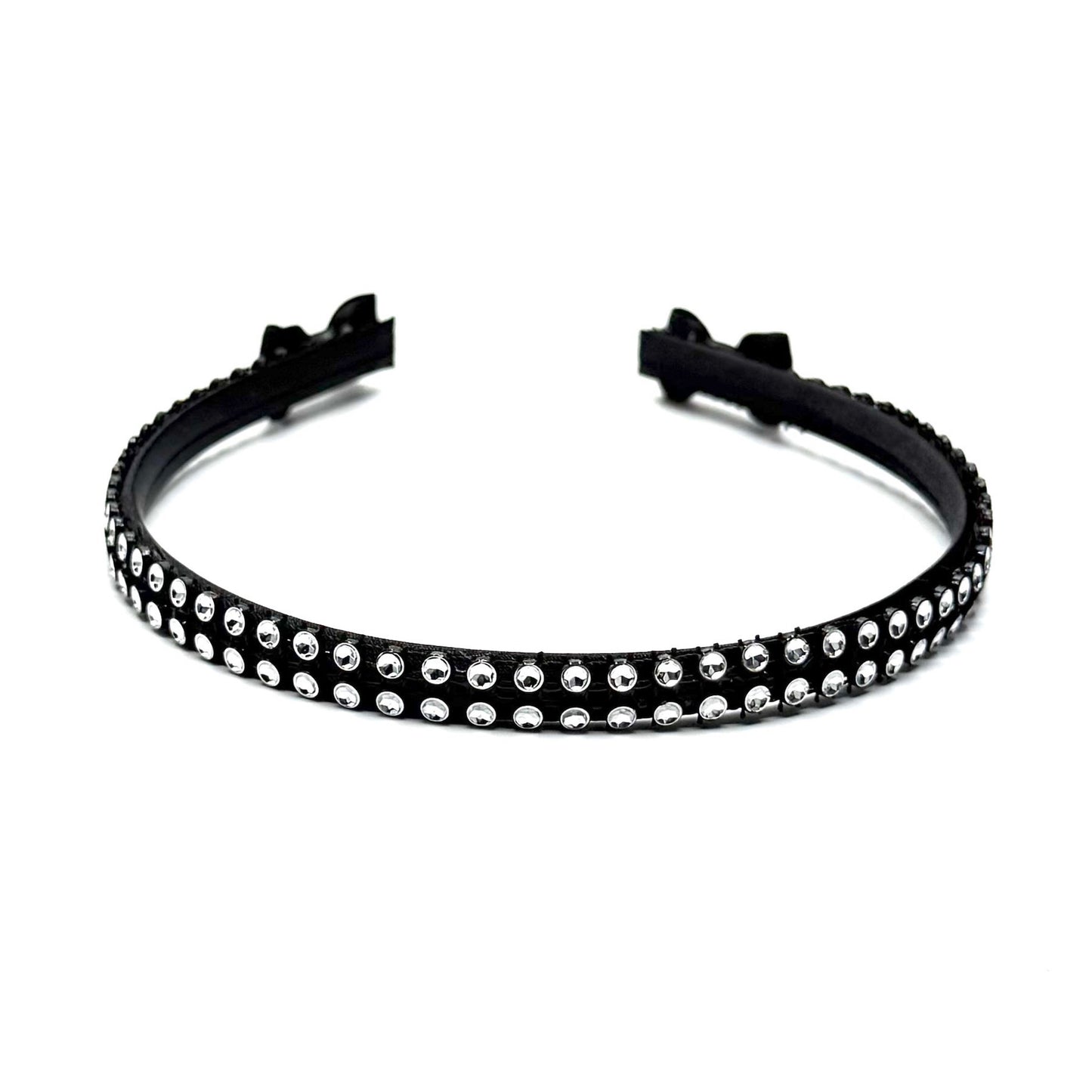 Black hairband with black and silver rhinestone mesh with black bows at the end on white background Top View