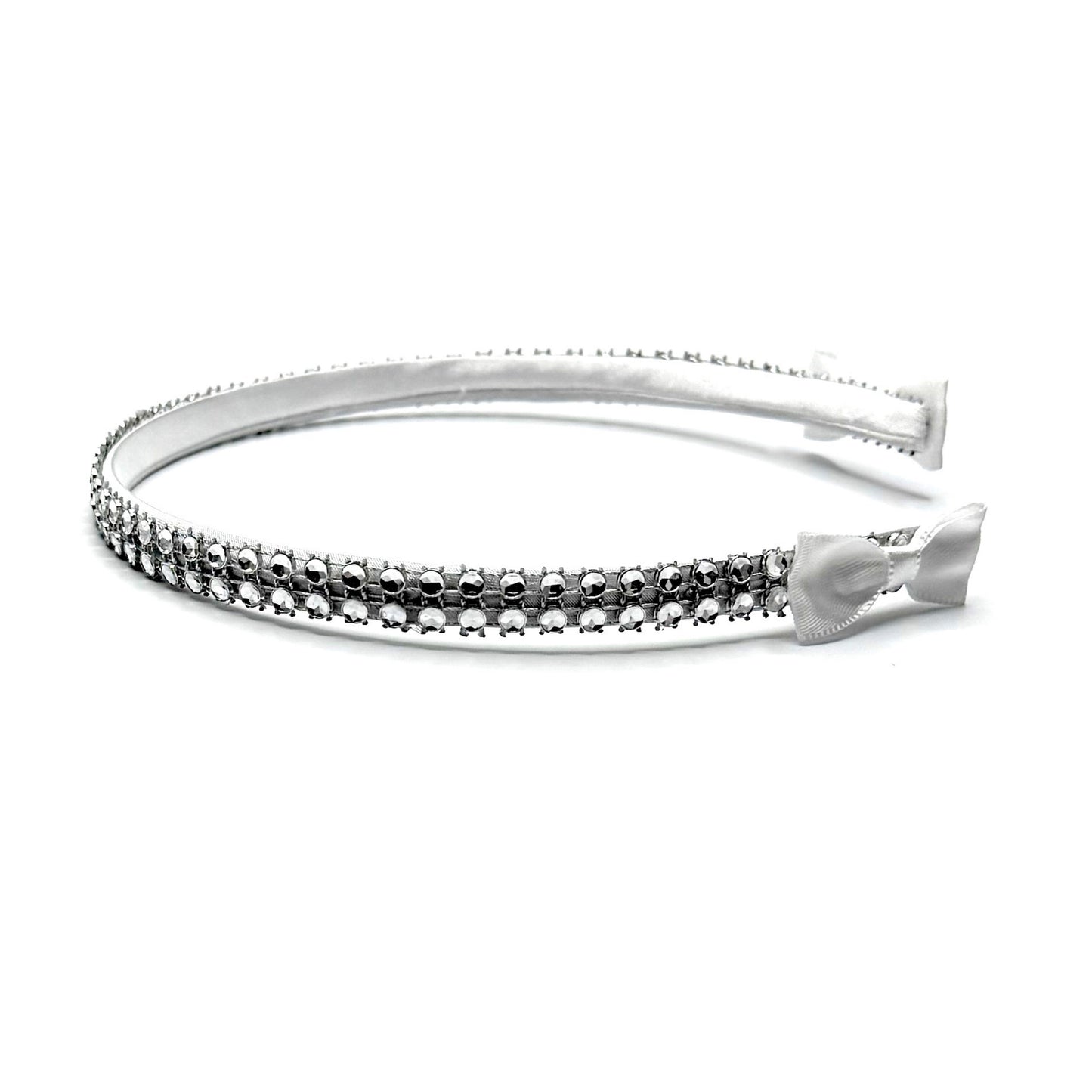 White Sparkly Headband with White and Silver Rhinestone Metsh with White Bows on the ends on a White Background Side View