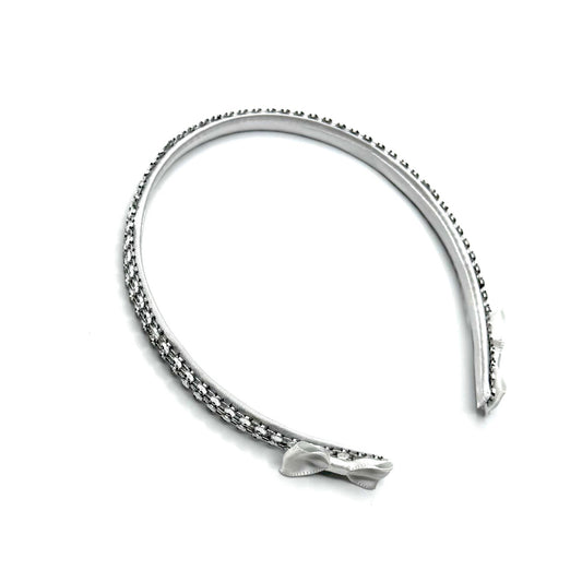 White Sparkly Headband with White and Silver Rhinestone Metsh with White Bows on the ends on a White Background