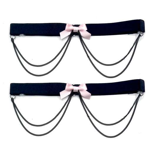 vice pink bow leg garters on white background