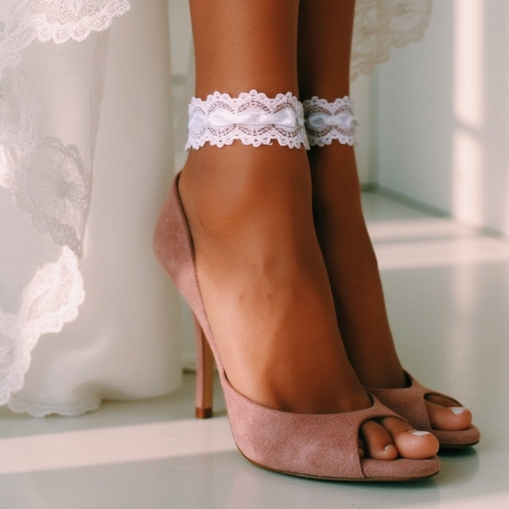 Close-up of a person wearing lace anklets with high-heeled shoes in a soft, blurred background in Chantilly White Lace Anklet