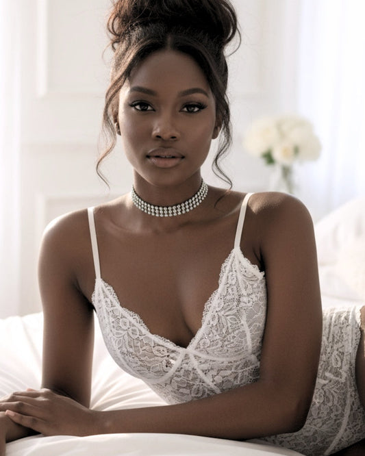 model with messy bun wearing lingerie and the vixen sparkly rhinestone mesh choker in an elegant white setting