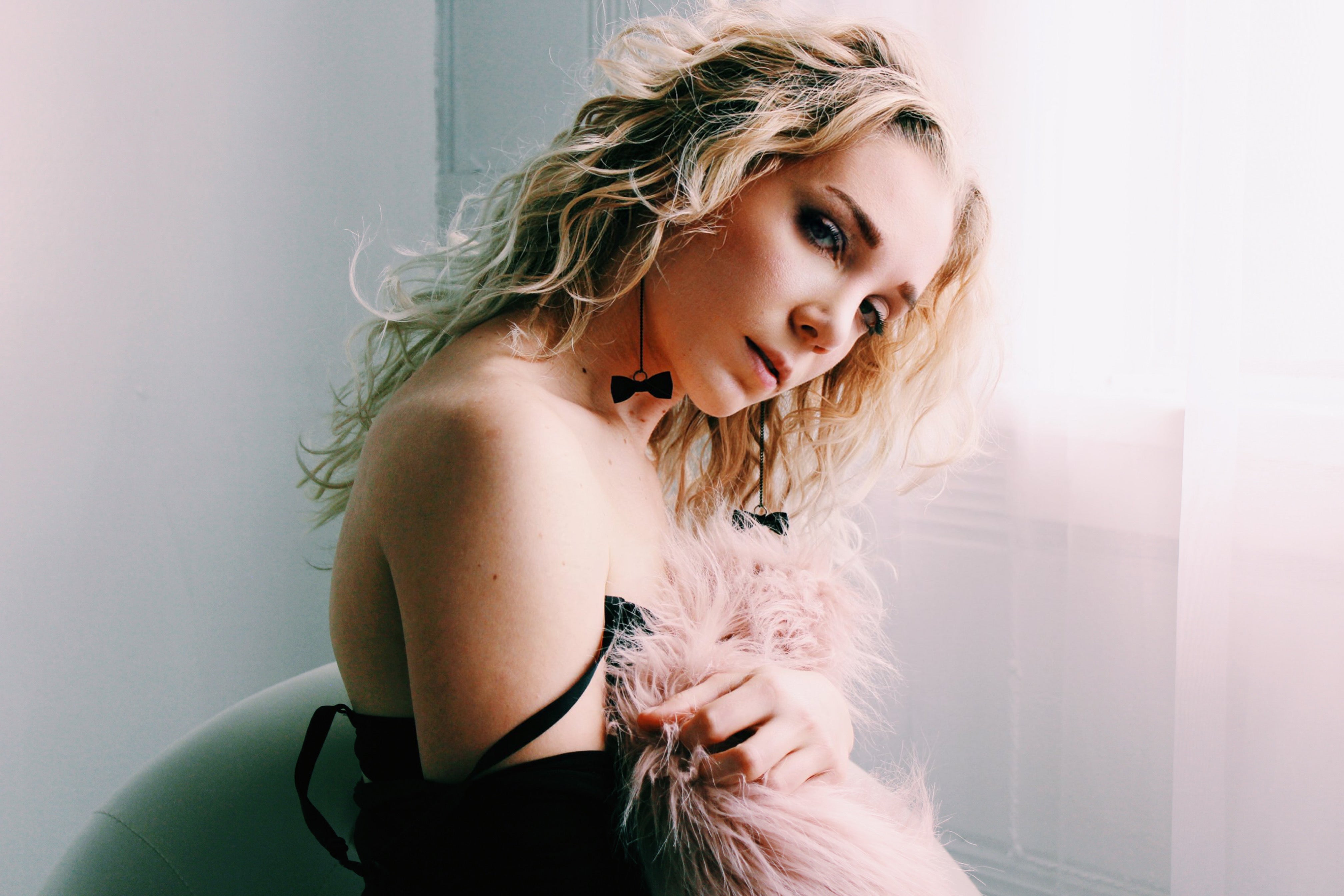 Blonde Model in Black Bow Earrings 