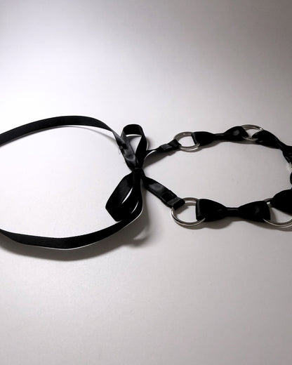 Runaway Bow Headband showing the tye on softly lit background
