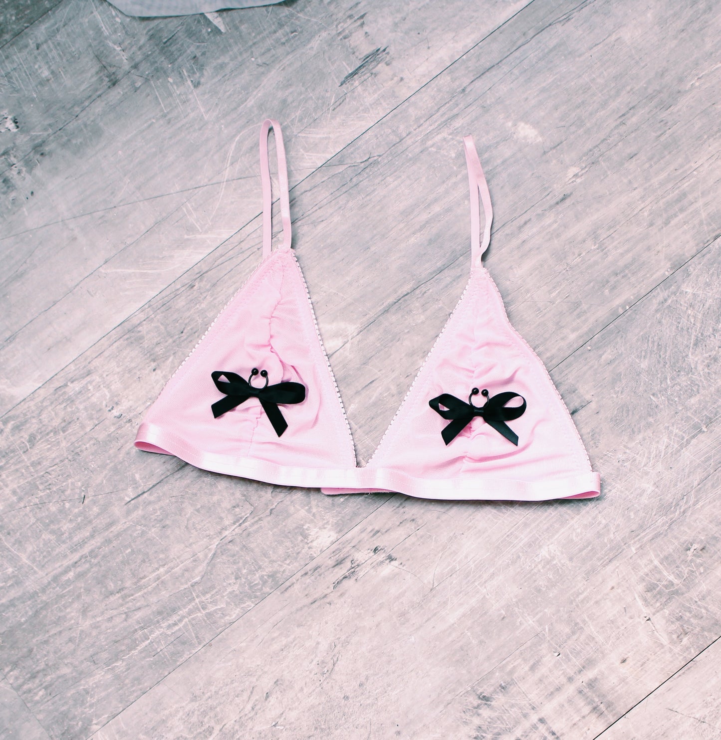 XO Nipple Clamps on Pink Bra