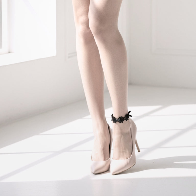Blossom Black Flower Bow Anklet on model in nude heels