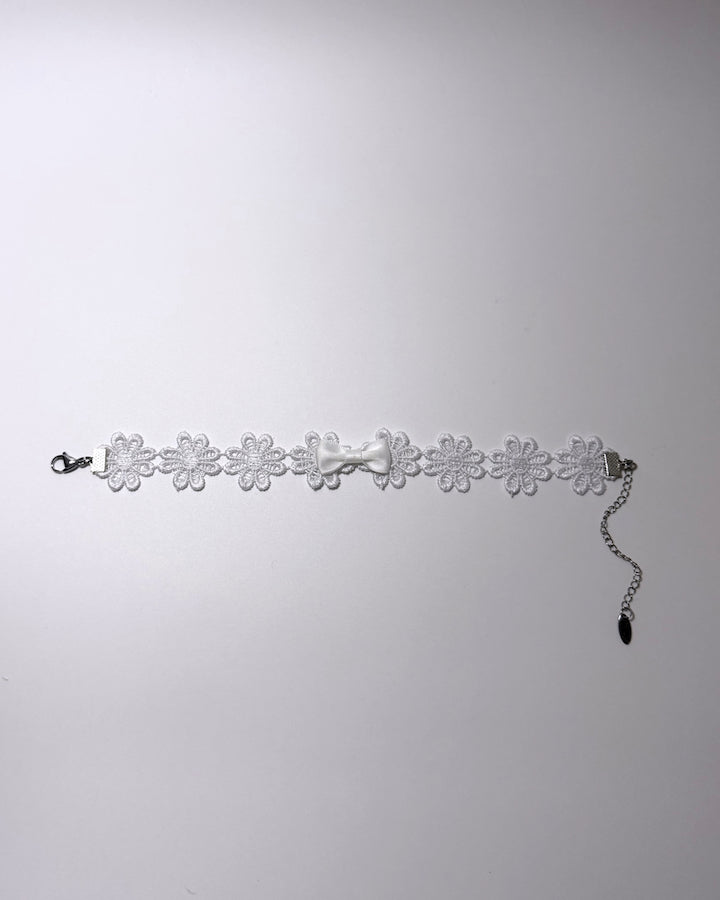 Flatlay of Blossom White Flower Anklet