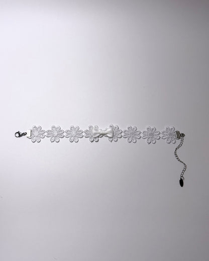 Flatlay of Blossom White Flower Anklet