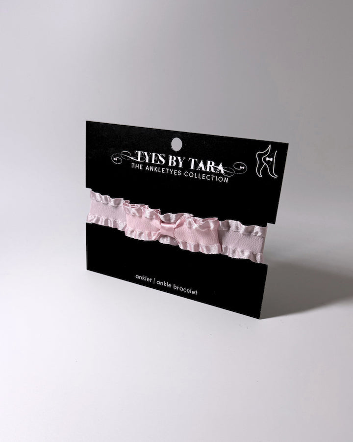 Double Ruffle Pink Bow Bracelet on Black Card