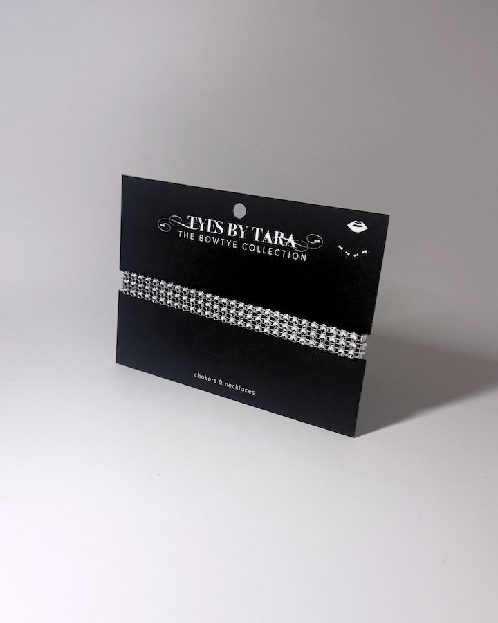 Vixen White Sparkly Choker displayed on a black card