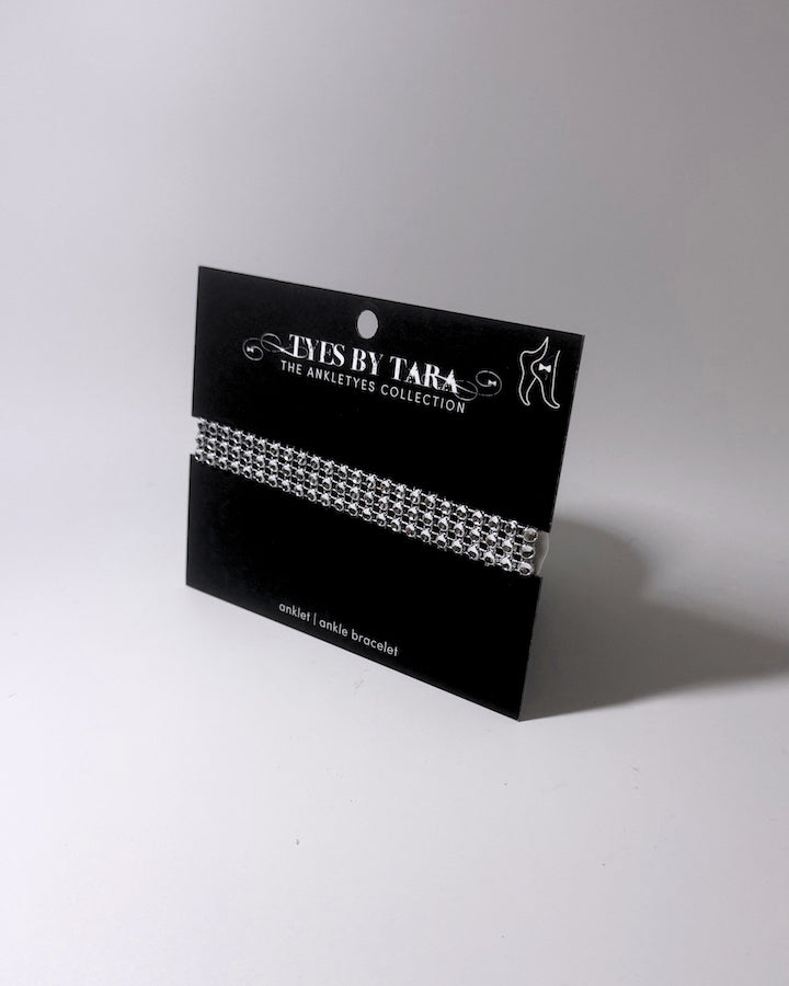 Vixen White Sparkly Bow Anklet on Black Card