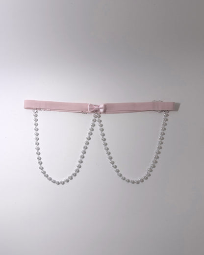 Centerfold Pink Bow Pearl Belt on softly lit background
