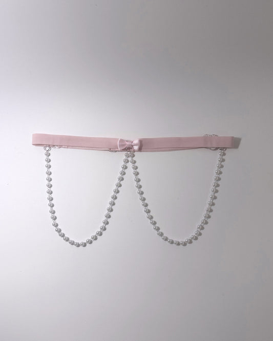 Centerfold Pink Bow Pearl Belt on softly lit background